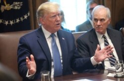 FILE - President Donald Trump speaks next to then-Acting Defense Secretary Richard Spencer during a cabinet meeting at the White House, in Washington, July 16, 2019.