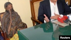 FILE - Pakistani Christian woman Asia Bibi is seen after a meeting with the governor of Punjab province at a jail in Sheikhupura, Pakistan.