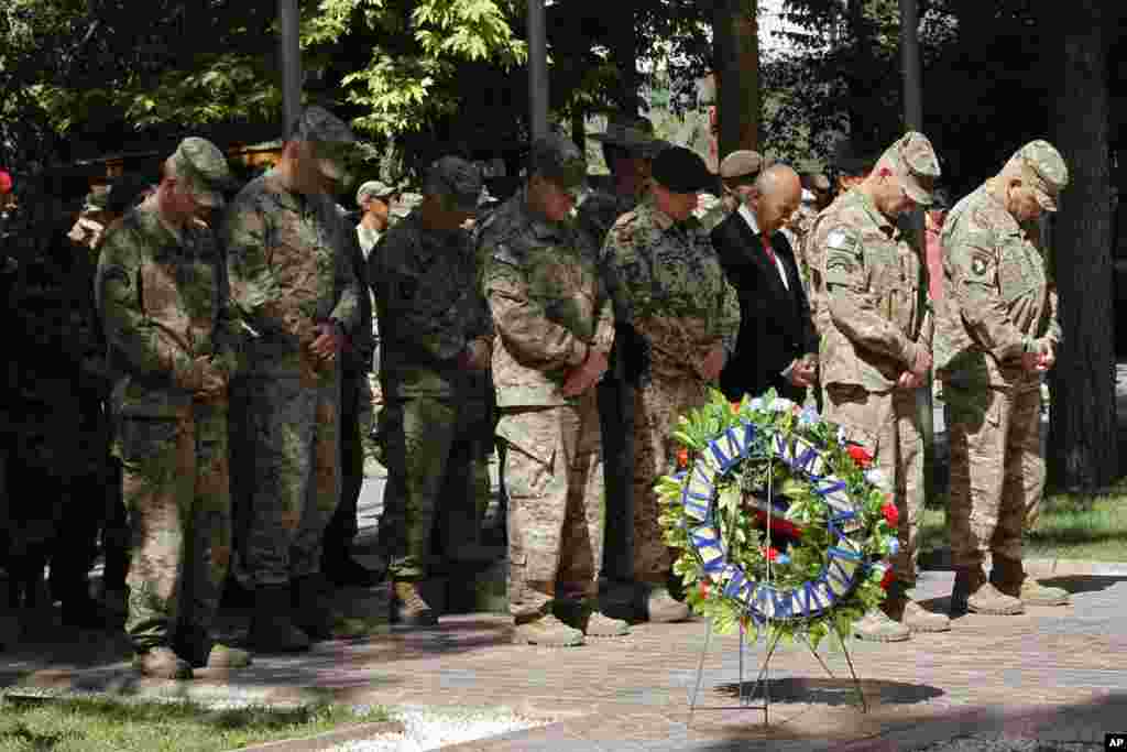 General John F. Campbell, commander of international forces in Afghanistan (second right) during a ceremony marking Memorial Day at the Resolute Support main headquarters in Kabul, May 25, 2015.&nbsp;