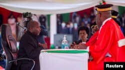 Burundi's President elect Evariste Ndayishimiye attends his inauguration ceremony following the sudden death of his predecessor Pierre Nkurunziza, at the Ingoma stadium in Gitega, Burundi, June 18, 2020. 