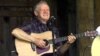 Master flatpicker Doc Watson performs at the annual Merlefest at Wilkes Comunity College in Wilkesboro, N.C. (2001 file photo)
