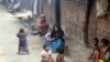 FILE - Myanmar Muslims, who identify themselves as long-persecuted “Rohingya” Muslims, sit on the ground at Da Paing camp for Muslim refugees in north of Sittwe, Rakhine State.