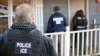 FILE - U.S. Immigration and Customs Enforcement, ICE agents at a home in Atlanta, Georgia.
