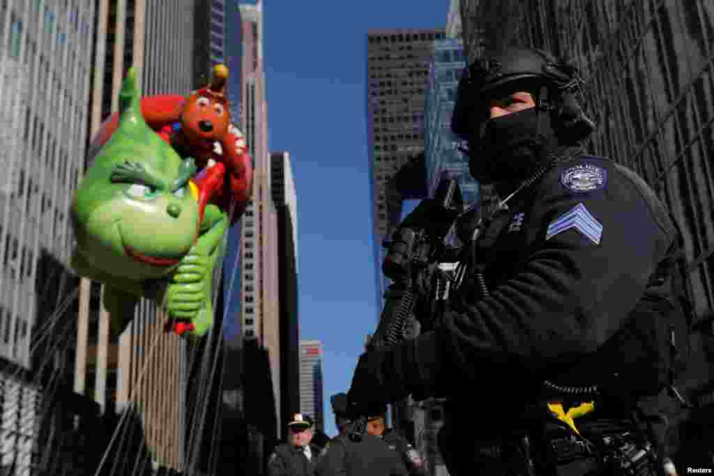 A member of the New York Police Department's Counterterrorism Bureau guards the parade route during the Macy's Thanksgiving Day Parade in Manhattan, Nov. 23, 2017.