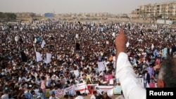 Members of Pakistan's Pashtun community, listen to their leader during a rally against, what they say, are human rights violations, organized by the Pashtun Tahaffuz Movement (PTM) in the southern city Karachi, Pakistan, May 13, 2018. 