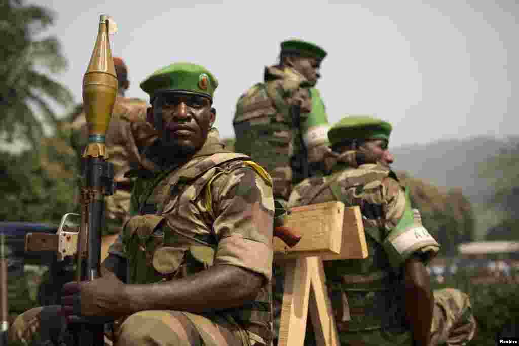 Soldiers from the AU peacekeeping mission prepare to leave at the end of a speech given by Alexandre Nguendet, the head of Central African Republic&#39;s transitional assembly at the Gendarmerie headquarters in Bangui on Jan. 13, 2014. 