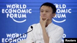 FILE - Chairman and chief executive of Alibaba Group Jack Ma reacts during a session of "Future-Proofing the Internet Economy" at the World Economic Forum (WEF) in China's port city Dalian, September 9, 2015.