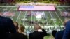 President Donald Trump, center, salutes as Jon Batiste performs the national anthem at the NFL Super Bowl 59 football game between the Philadelphia Eagles and the Kansas City Chiefs, in New Orleans, Louisiana, Feb. 9, 2025.