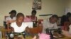 FILE - Girls learn to make sanitary pads from imported water-proof materials in project sponsored by the Malawi NGO, Girls Empowerment Network (VOA / L. Masina) 