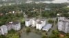 An aerial view shows partially submerged buildings at a flooded area in the southern state of Kerala, India, Aug. 19, 2018.