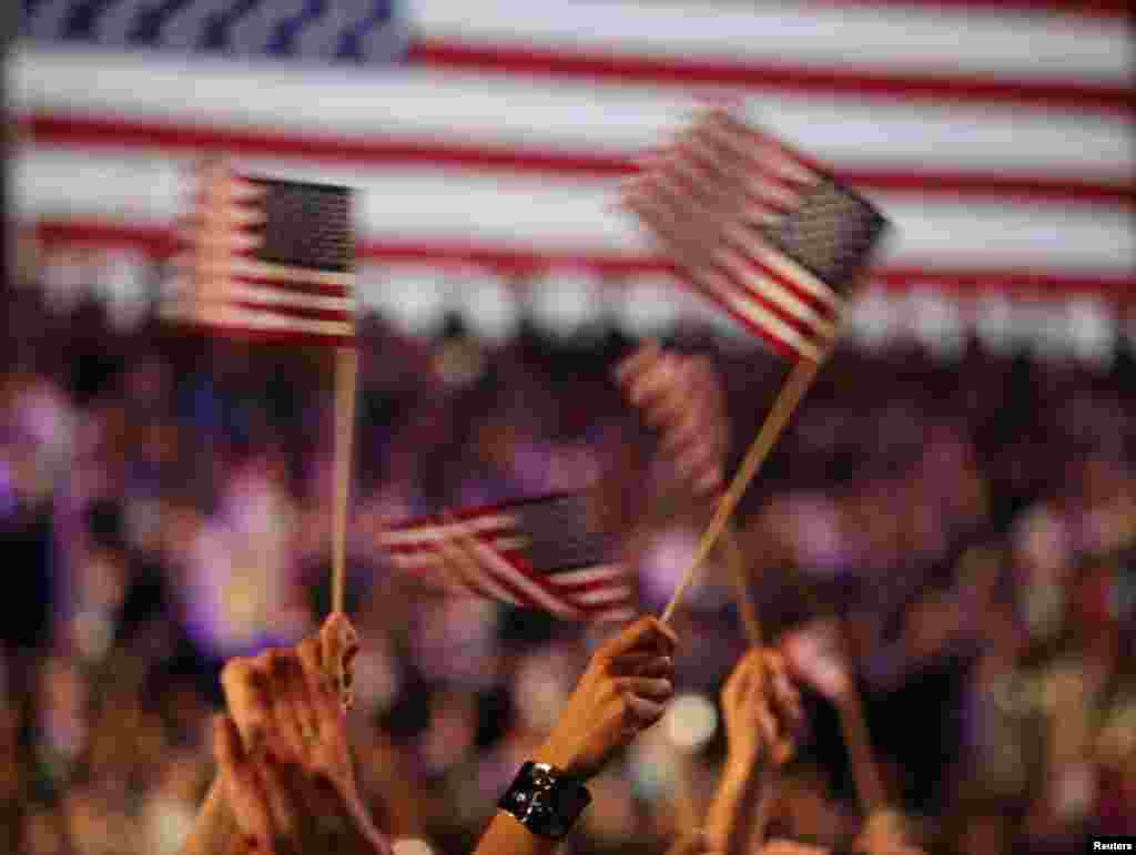 Supporters of U.S. President Barack Obama cheer during his election night rally in Chicago, November 6, 2012.