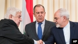 Para Menteri Luar Negeri Rusia, Suriah dan Iran usai melakukan konferensi pers bersama di Moskow hari
Jumat (14/4).