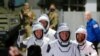 Astronot NASA Shane Kimbrough dan Megan McArthur, astronaut JAXA Akihiko Hoshide, dan astronaut ESA Thomas Pesquet tiba untuk menaiki roket SpaceX Falcon 9 dengan kapsul Crew Dragon. (Foto: Reuters)