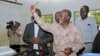 Tanzanian presidential candidate of the ruling CCM party, John Magufuli, displays his ballot paper before casting his vote in the presidential and parliamentary election at his hometown Chato district, in Geita region, Tanzania, Oct. 25, 2015.