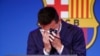 Lionel Messi cries at the start of a press conference at the Camp Nou stadium in Barcelona, Spain. FC Barcelona had previously announced the negotiations with Lionel Messi had ended and that Messi would be leaving the club.