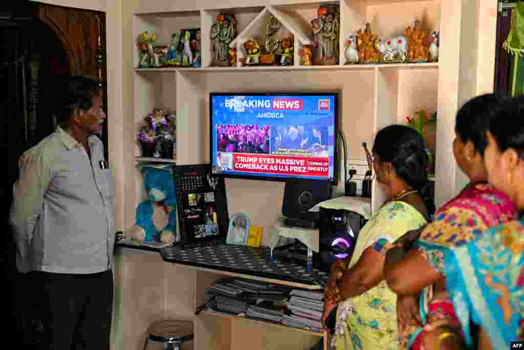Villagers watch the 2024 U.S. presidential election poll results inside a house in Vadluru, the ancestral village of Usha Vance's parents, wife of U.S. Senator and Republican vice presidential candidate JD Vance, at the West Godavari district in India's Andhra Pradesh state on Nov. 6, 2024.