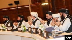 Members of the Taliban attend the second day of the Intra Afghan Dialogue talks in the Qatari capital, Doha, July 8, 2019. 