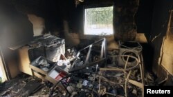 An interior view of the damage at the U.S. consulate, which was attacked and set on fire by gunmen in Benghazi on September 12, 2012. Christopher Stevens, the U.S. ambassador to Libya, and three embassy staff were killed as they rushed away from the consulate building, stormed by al Qaeda-linked gunmen.