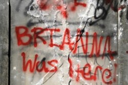 Graffiti is show on the damaged base of a Confederate memorial that was removed overnight in Birmingham, Ala., on June 2, 2020.