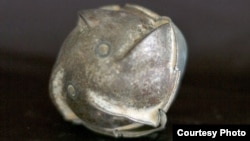 FILE - Cluster munitions can release hundreds of bomblets over a wide area. Not all explode after hitting the ground, posing a landmine-like danger. (CMC)