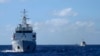 Chinese coastguard ships give chase to Vietnamese coastguard vessels (not pictured) after they came within 10 nautical miles of the Haiyang Shiyou 981, known in Vietnam as HD-981, oil rig in the South China Sea, July 15, 2014.