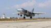 FILE - A Russian Sukhoi Su-24 bomber takes off from the Hmeimim airbase in the Syrian province of Latakia, October 3, 2015.