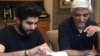 Danish Bashir eats dinner with his father, Imran, at their home in Springfield, Virginia. (C. Presutti/VOA)
