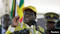 FILE - Zimbabwean President Robert Mugabe is seen addressing supporters in Harare, Zimbabwe, Dec. 4, 2014.