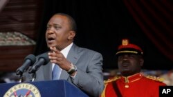 FILE - Kenyan President Uhuru Kenyatta delivers a speech at the Nyayo Nationa Stadium in Nairobi, Kenya. 
