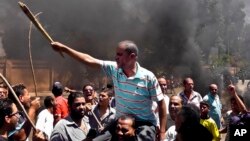 Egyptians chant slogans during clashes between supporters and opponents of Egypt's president and his Muslim Brotherhood in Luxor, June 19, 2013.
