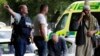 FILE - Police outside a mosque in Christchurch, New Zealand, March 15, 2019, following a shooting. An inquiry that began Oct. 24, 2023, will examine the response times of police and medics and whether any of the 51 people who were killed could have been saved.