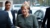German Parties Seek Compromise on Migrants, Climate Change