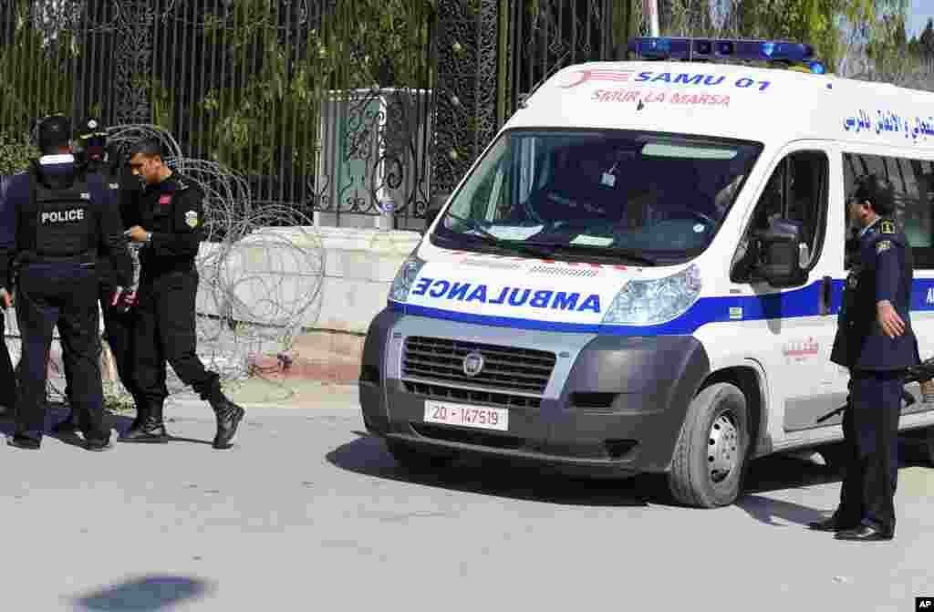 An ambulance leaves the Bardo museum, in Tunis, Tunisia, March 18, 2015.