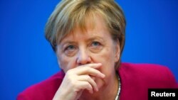 German Chancellor Angela Merkel attends a board meeting following the Hesse state election in Berlin, Germany, Oct. 29, 2018.