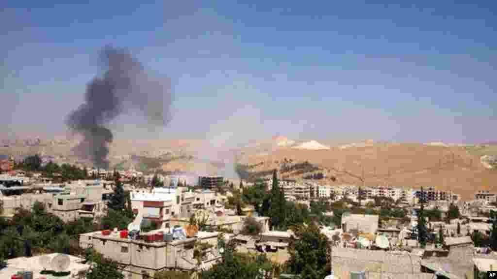 Black smoke from government forces shelling in Damascus, Sept. 1, 2013.
