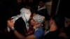 Freed Palestinian prisoner Rami Barbakh, who was held by Israel for 20 years, hugs his mother upon his release, in Khan Younis in the southern Gaza Strip, Dec. 31, 2013.