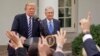 Wartawan mengangkat tangan mereka, menunggu giliran untuk mengajukan pertanyaan kepada Presiden Donald Trump dan Pemimpin Mayoritas Senat AS, Mitch McConnell dari Kentucky, di Taman Mawar Gedung Putih, Senin, 16 Oktober 2017. (AP Photo / Pablo Martinez Monsivais)