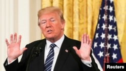 FILE - President Donald Trump delivers remarks at the White House in Washington, May 18, 2018. 