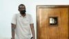 FILE - Ugandan author Kakwenza Rukirabashaija appears before a court in a failed bid to have his passport returned, in Kampala, Uganda, Feb. 1, 2022.