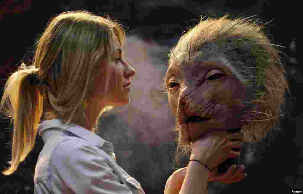 A representative of Makinarium production, specialized in special visual effects, displays a latex mask for horror movie on a stand inside the Festival Palace during the 69th Cannes Film Festival in Cannes, France, May 14, 2016. 
