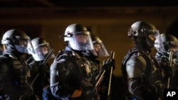 Portland police take control of the streets after making arrests on the scene of the nightly protests at a Portland police precinct on Aug. 30, 2020 in Portland, Ore.