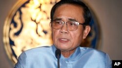 Thailand's Prime Minister Prayuth Chan-ocha talks to reporters at the government house Bangkok, Thailand, Aug. 28, 2018.