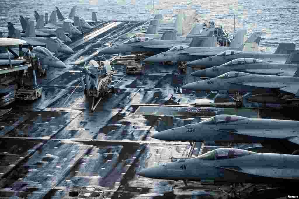 F/A-18E and 18F Super Hornets are seen on the flight deck of the Nimitz-class aircraft carrier USS Harry S. Truman (CVN 75) in the Adriatic Sea, off Split, Croatia.