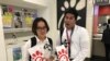 Asian Americans Advancing Justice interns Dieu Linh Nguyen, left, and Tauheed Islam got free sandwiches July 8 at a Chick-fil-A cow appreciation event. (A. Peng)