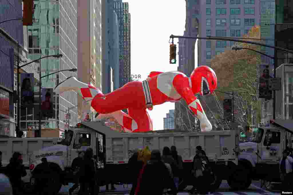 Sanitation trucks are positioned across 42nd street as ram attack barricades during the Macy's Thanksgiving Day Parade in Manhattan, New York, Nov. 23, 2017.