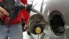 FILE - World oil prices are likely to remain relatively low over the next year, but a new report predicts a big increase after that.