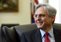 FILE - In this May 10, 2016 photo, President Barack Obama's Supreme Court nominee Merrick Garland meets with Sen. Brian Schatz, D-Hawaii, on Capitol Hill in Washington.