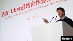 CEO Uber Travis Kalanick berbicara dalam acara penandatanganan kerjasama dan investasi strategis antara Baidu dan Uber di markas besar Baidu di Beijing, 17 Desember 2014.