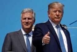 FILE - President Donald Trump and Robert O'Brien, the new national security adviser, board Air Force One at Los Angeles International Airport, Sept. 18, 2019, in Los Angeles.