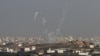 Trails of smoke are seen after the launch of rockets from the northern Gaza strip towards Israel, November 11, 2012. 